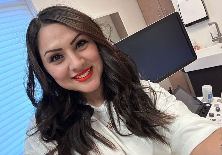 beautiful surrogate mother smiling after meeting surrogate requirements